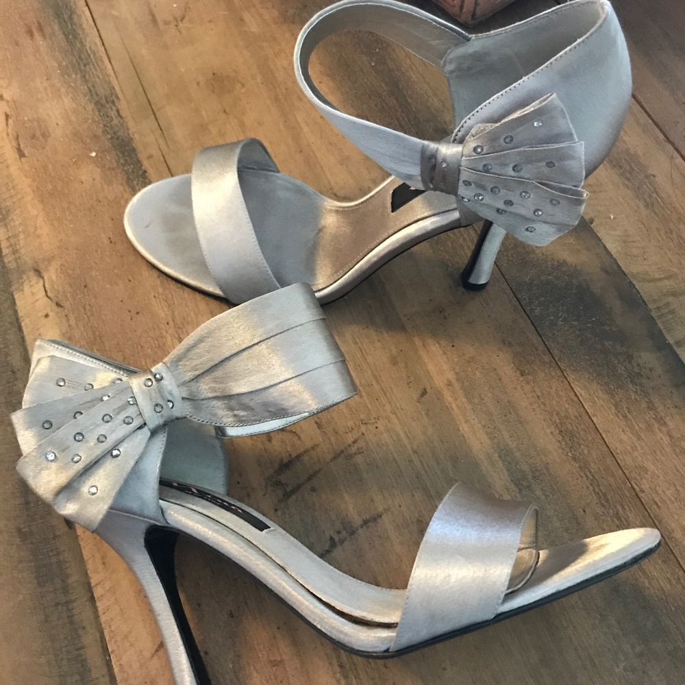 Silver high heels.